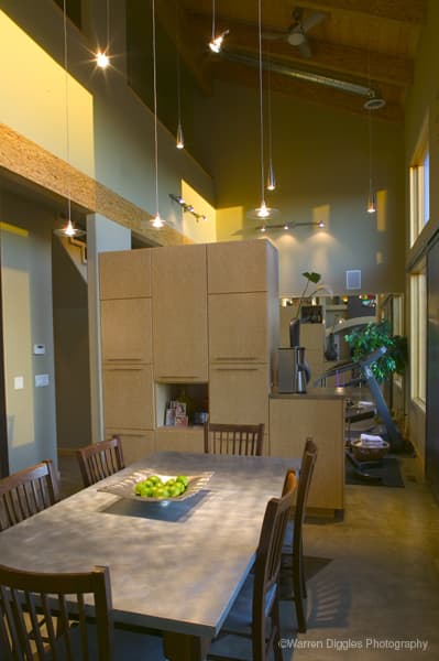 A pony wall defines a space without extending to the ceiling.