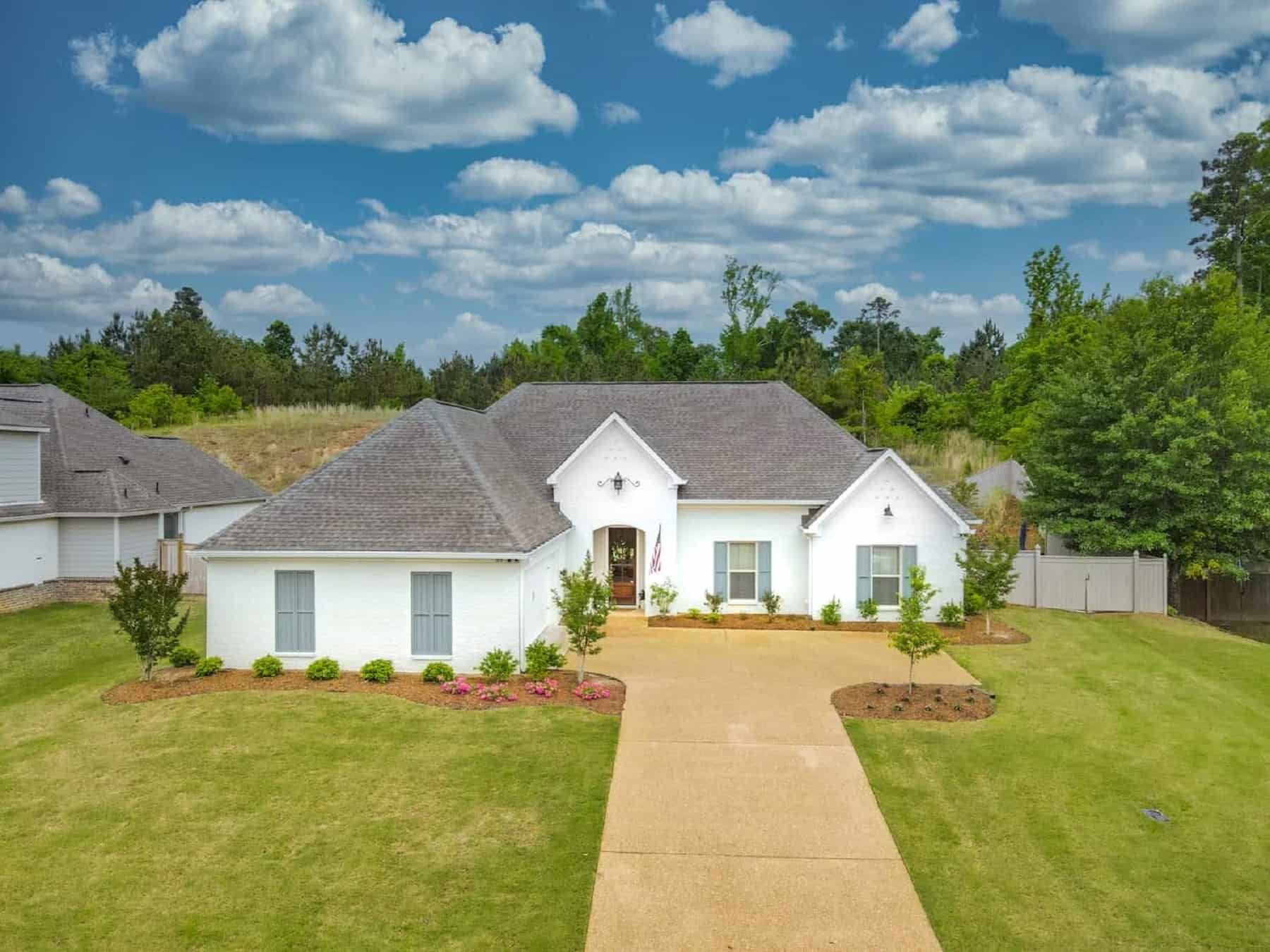 Front elevation of Acadian home (ThePlanCollection: House Plan #140-1135)