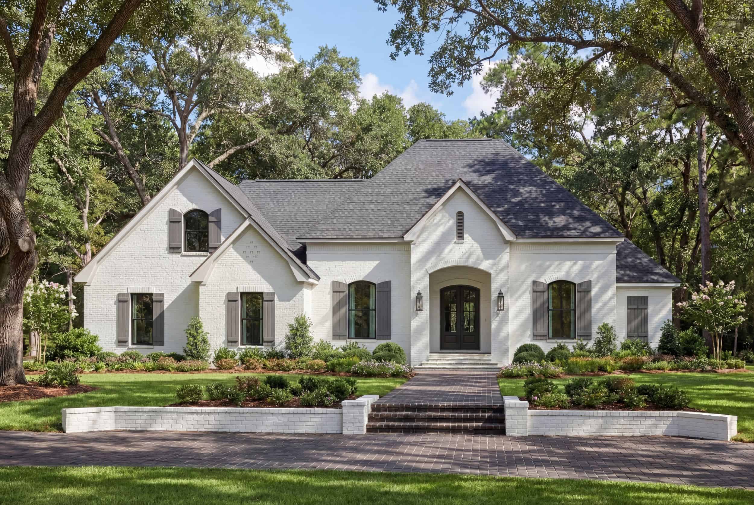 Front elevation of Acadian home (ThePlanCollection: House Plan #142-1502)