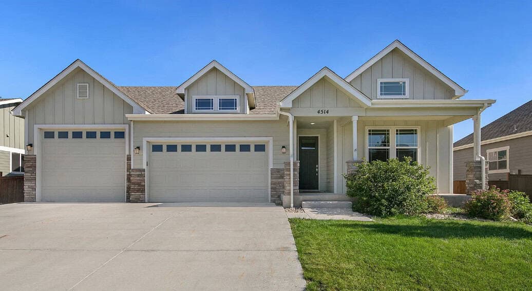 Craftsman Ranch facade with covered front porch, stone accents, and a four-bay garage wing. 3 beds, 1,654 sq ft — Plan #161-1289.