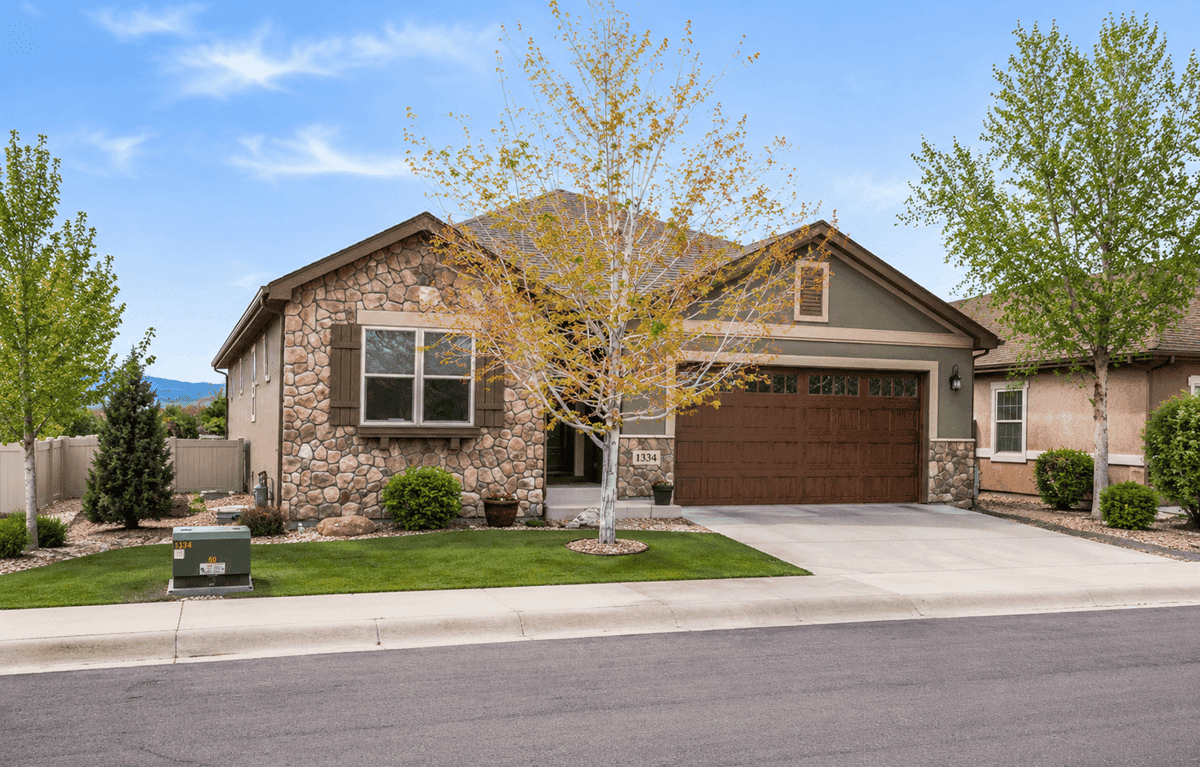 A Southwest home with smooth stucco walls, stone accents, and a covered front porch. 2 beds, 1,655 sq ft — Plan #161-1296.