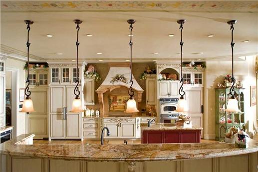 Opulent kitchen with large kitchen island and eating bar.